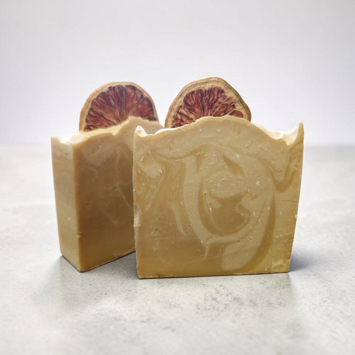 Lemon Drop Glow Bar - two bars on marble surface with dried lemon slice on top