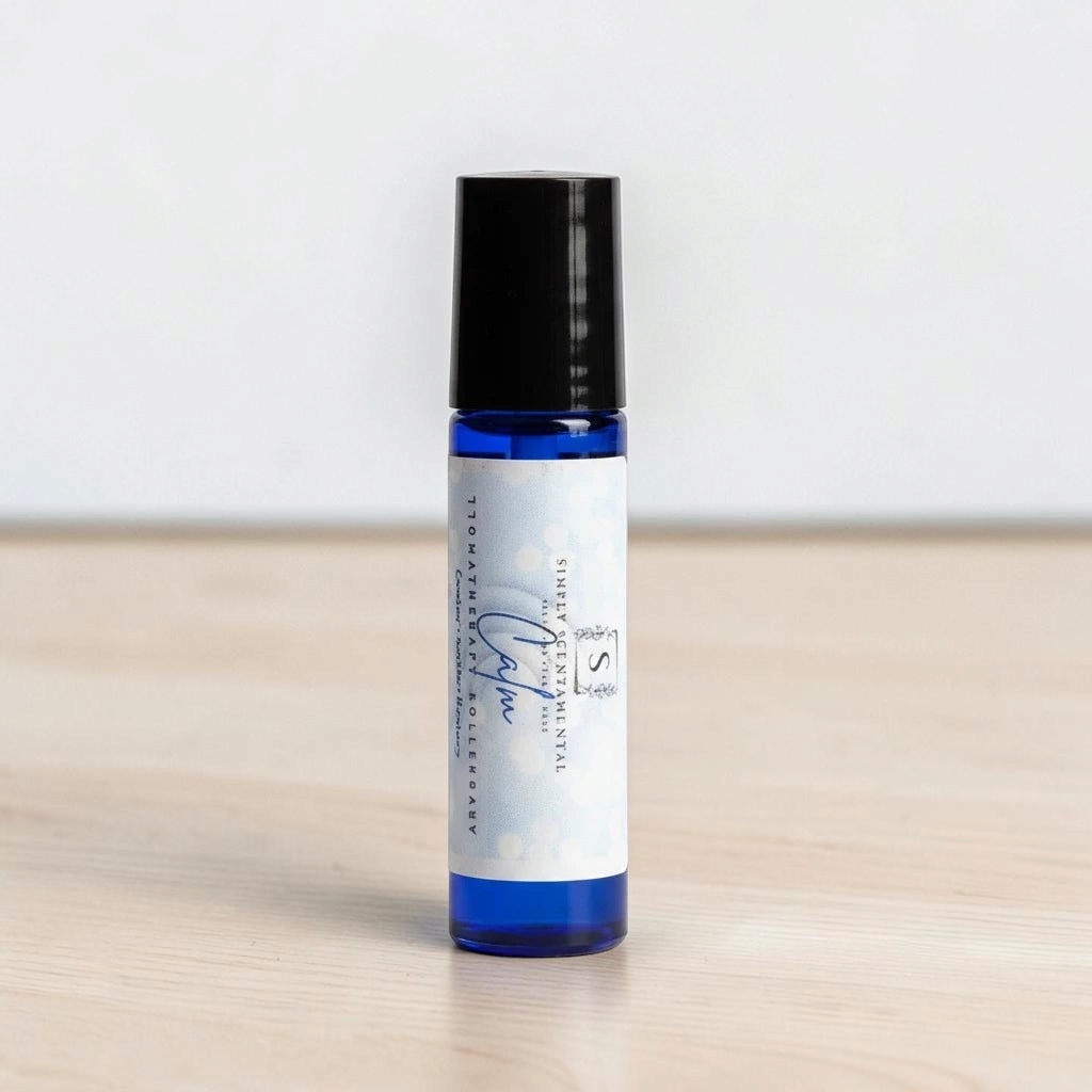 Simply Scentamental Calm aromatherapy rollerball in a blue glass bottle with a black cap on a white background.
