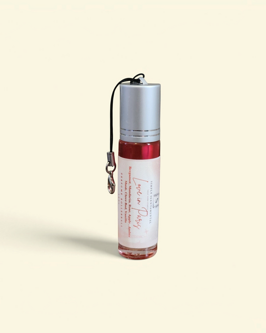 Simply Scentamental Love in Paris 10ml perfume oil rollerball with a silver cap and convenient carrying strap