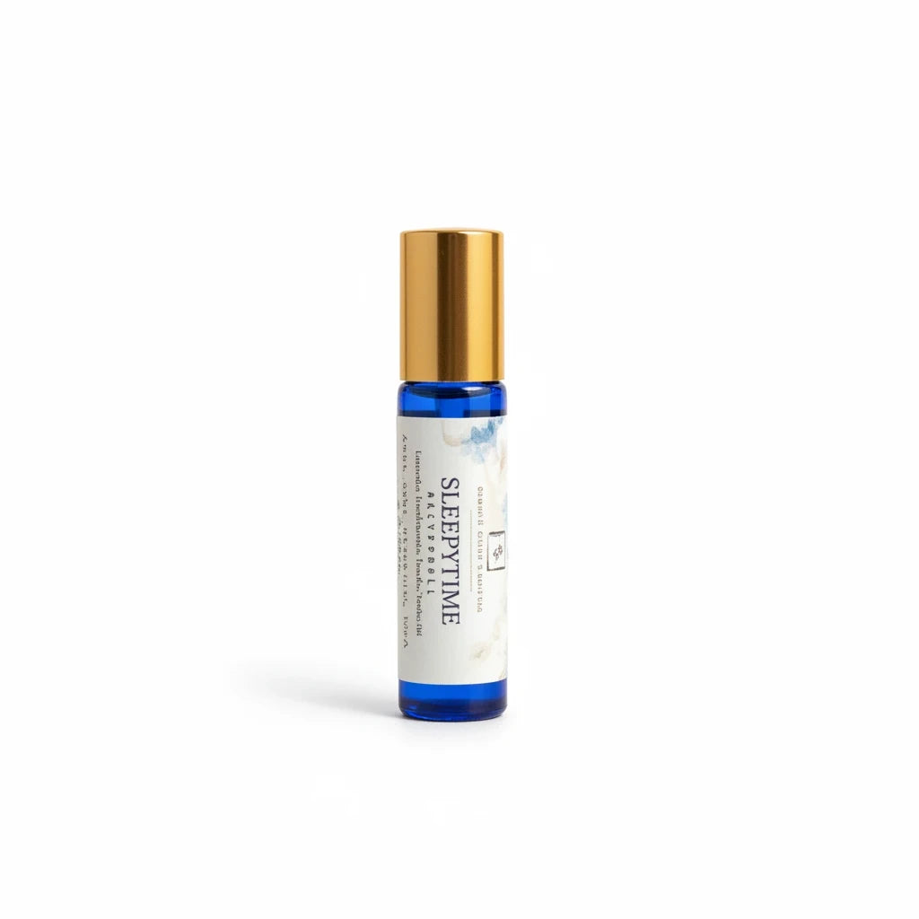 Simply Scentamental Sleepytime aromatherapy rollerball in a blue glass bottle with a gold cap for bedtime relaxation.